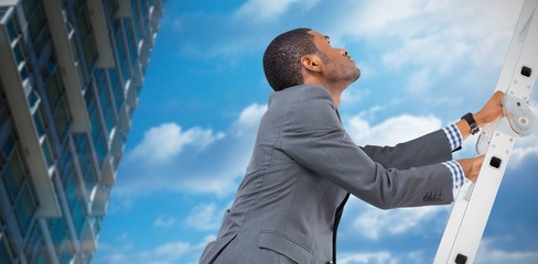 Composite image of businessman climbing up ladder © vectorfusionart