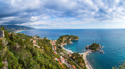 Obraz premium Taormina, Sicily - Beautiful landscape view of Mazzaro and Isola Bella Sicilian island of the mediterranean with beach and turquoise sea water
