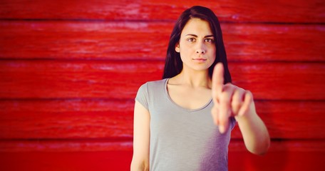 Composite image of portrait of young woman pointing