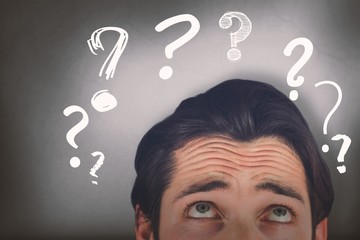 Composite image of cropped image of man looking up