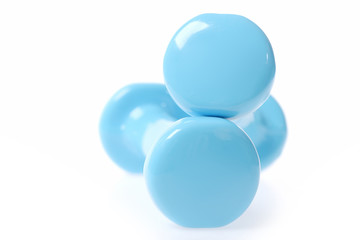 Two round edges of cyan blue dumbbells making minimalistic composition