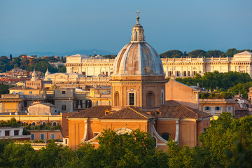 Fototapeta na wymiar Aerial wonderful view of Rome with San Giovanni dei Fiorentini church at sunset time in Rome, Italy