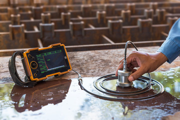 Ultrasonic test to detect imperfection or defect of steel plate in factory, NDT Inspection.