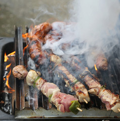 skewers of meat with vegetables cooked