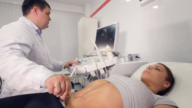 Aerial close up of ultrasound examination of the abdominal cavity 