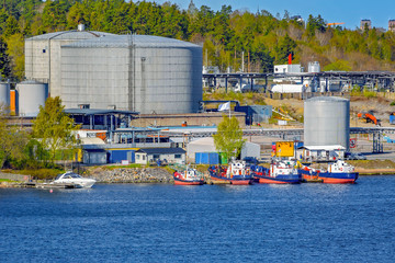 Obraz premium Oil product tank depot in Stockholm industrial sea port. Sweden.
