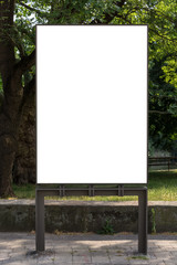 Blank ad space sign isolated in front of a park