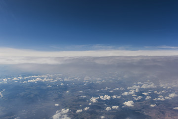 Fototapeta na wymiar clouds from airplane window 
