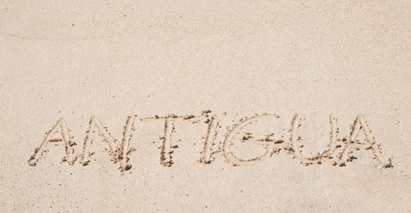 Antigua written on a sandy beach.