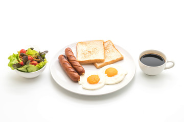 fried eggs with sausage and bread