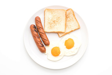 fried eggs with sausage and bread