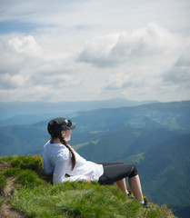 Naklejka na ściany i meble Tourist relax on the mountain top. Sport and active life concept