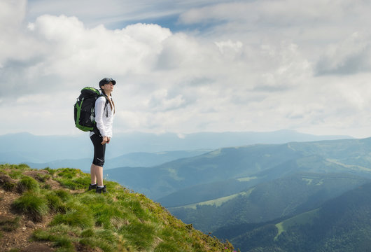 Tourist relax on the mountain top. Sport and active life concept