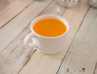 Orange juice in white cup