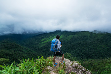 backpacker enjoy beautiful view on top of the mountain