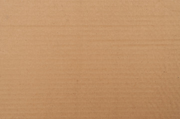 Corrugated cardboard brown color. Texture.