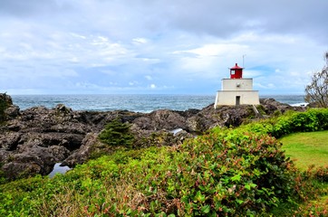 Fototapeta na wymiar Historic lighthouse along the Wild Pacific Trail at Ucluelet, Vancouver Island, BC, Canada