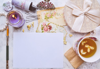 Vintage mockup. Blank paper, pencil, candle, vintage cards, dried plants, tea cup, hairpins