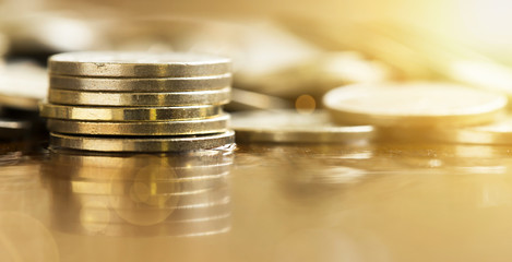 Business success - website banner of money coins closeup