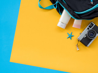Summer Flat Lay Photo with blue and yellow background.
