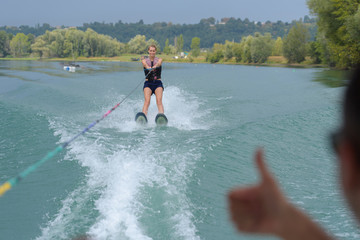 young woman wakeboarding