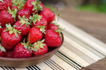 Strawberries ripe red on wooden table