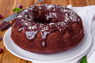Moist chocolate cake with cherry and glaze