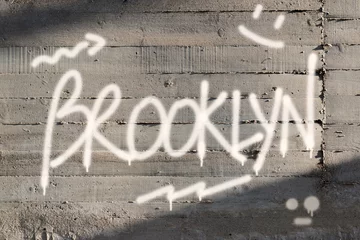 Photo sur Aluminium Graffiti Brooklyn Word Graffiti Painted on Wall