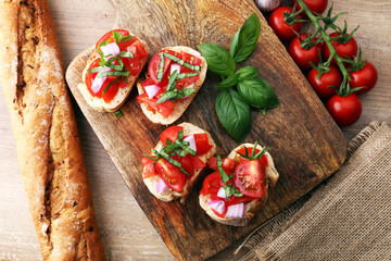 Bruschetta with tomatoes, herbs and oil on toasted garlic cheese bread toasted with chopped tomatoe