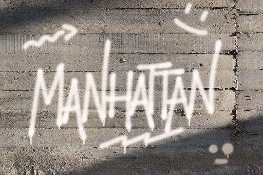 Fototapeta Manhattan Word Graffiti Painted on Wall