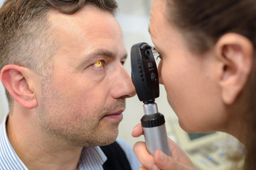 man having eye test eye test machine