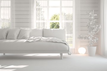 Fototapeta premium White room with sofa and green landscape in window. Scandinavian interior design. 3D illustration
