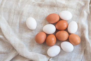 White and brown eggs on fabric