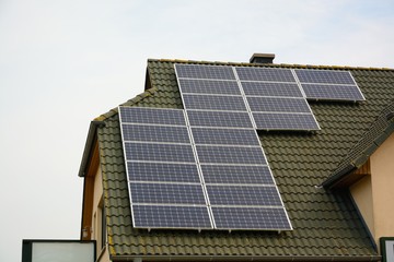 Fototapeta premium Solar energy panels on roof of house