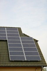 Fototapeta premium Solar energy panels on roof of house