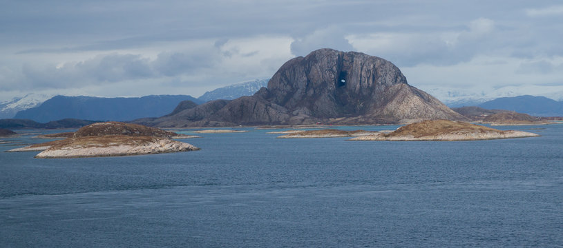 Torghatten mountain just outside of Br&oslash;nn&oslash;ysund in the north of Norway. This mountain is famous due to the hole in the middle.