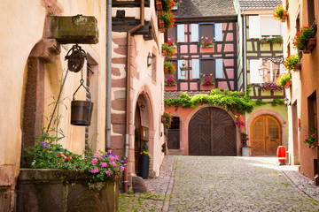charming alley in medieval village Riquewihr, Alsace, France