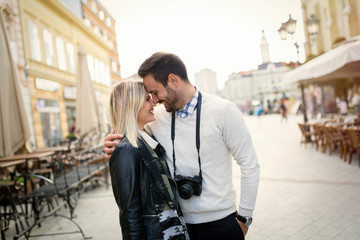 Fototapeta premium Tourist couple enjoying sightseeing and exploring city