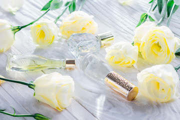 Bottles of perfume with eustoma flowers