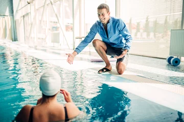 Foto op Plexiglas Female swimmer in cap with male personal trainer © Nomad_Soul