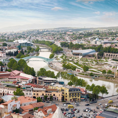 Fototapeta premium Tbilisi city panorama. Old city, new Summer Rike park, river Kura, the European Square and the Bridge of Peace