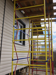 repaired rural house, fixed the facade, waterproofing wood house by vinyl plasting siding