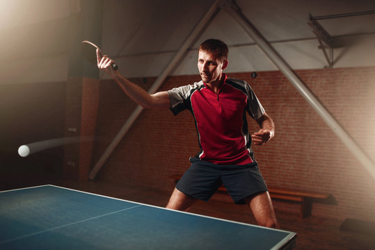 Table tennis, player in action, ball with trace