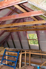 Building Attic Interior. Wooden Roof Frame House Construction. Roofing Construction Indoor.