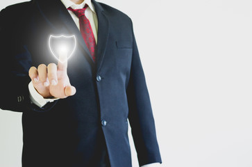 Businessman pressing shield icon in the air