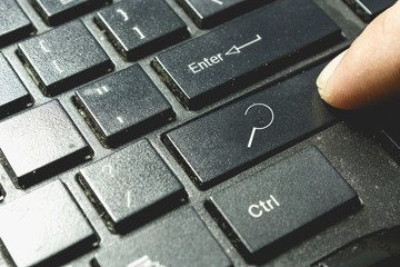 Search icon on keyboard. Finger pressing button. Cyber security concept.