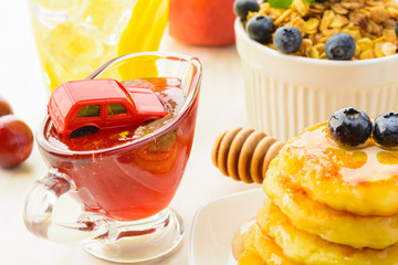 Car in traffic jam concept after breakfast in rush hour, epic fail, closeup view