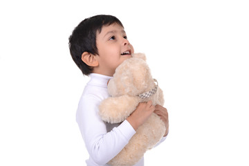 the boy  with a bear in hands and rejoices