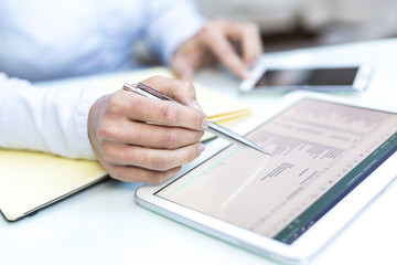 Accounting on a tablet computer, close-up