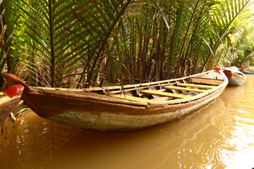 asian empty canoe boat on the river close up photo 
